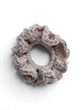 Criminal Crochet light pink textured crochet scrunchie hair accessory made from soft yarn.