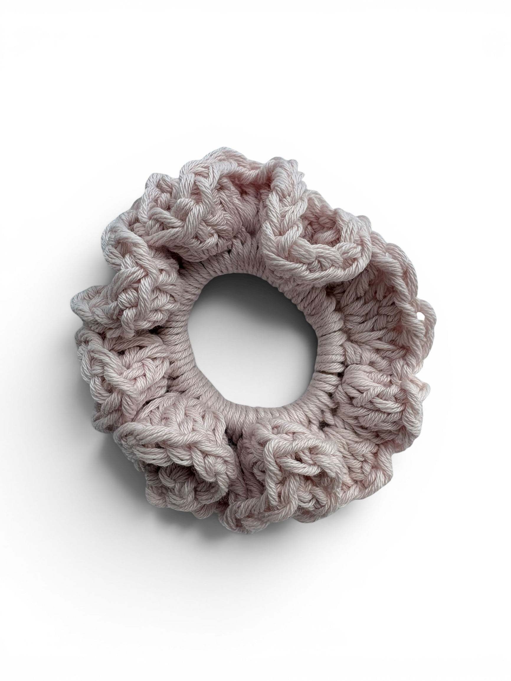 Criminal Crochet light pink textured crochet scrunchie hair accessory made from soft yarn.